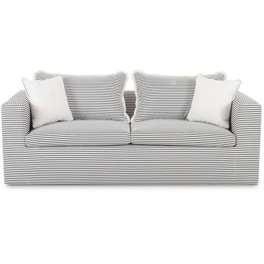 Sofa tapicerowana o miekkim zarysie z lyagodnym konturem w odcieniu bieli do salonu