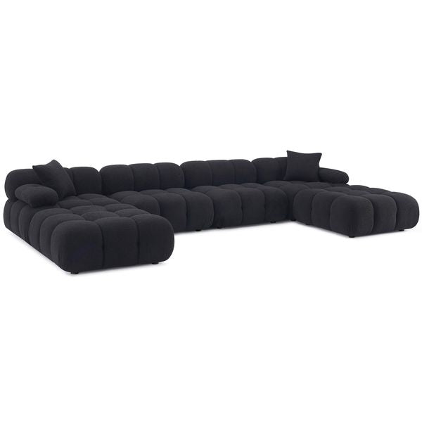 Sofa tapicerowana o spokojnej linii z wywazonymi proporcjami w odcieniu czerni