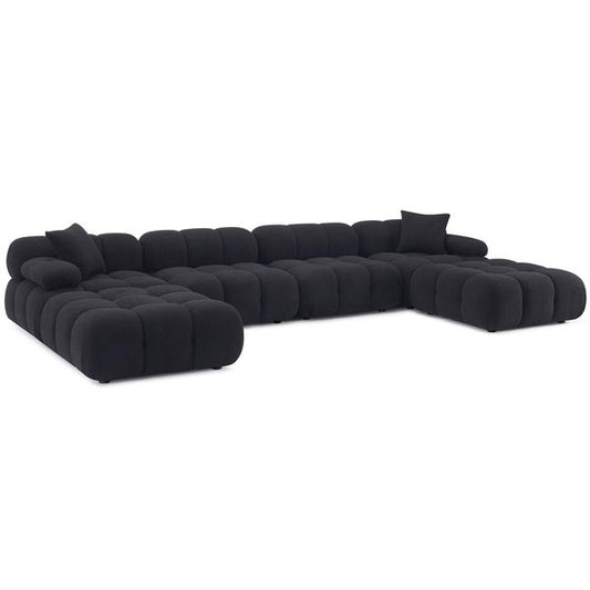 Sofa tapicerowana o spokojnej linii z wywazonymi proporcjami w odcieniu czerni